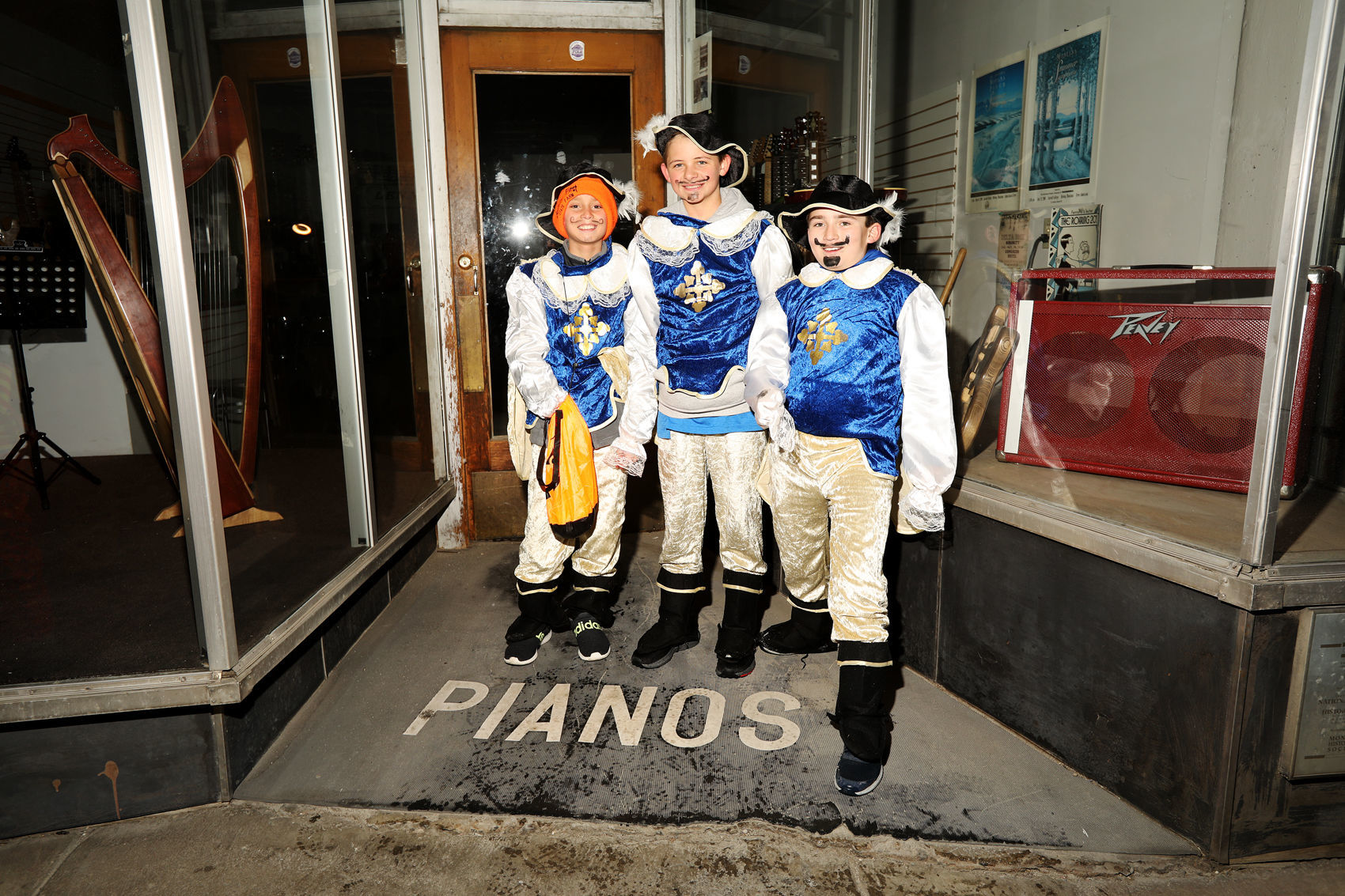 Three Musketeers watch the Butte Halloween Parade
